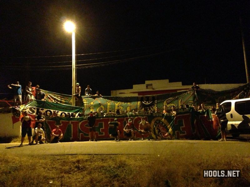 Sevilla hooligans with flags taken from Slask Wroclaw fans, 22 August 2013.