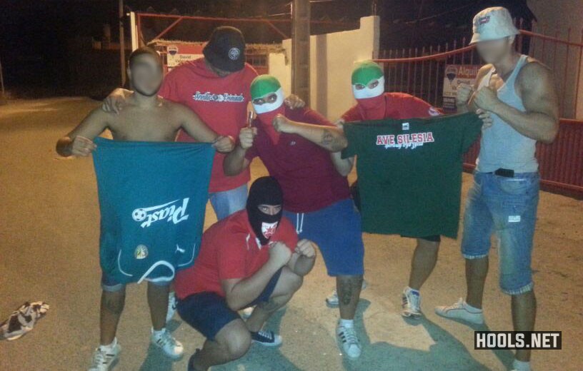 Sevilla hooligans pose with Slask Wroclaw t-shirts, 22 August 2013.