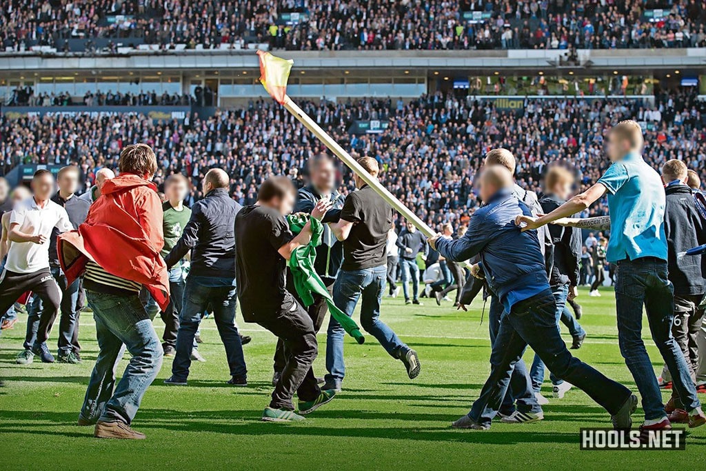 Hibs and Rangers fans fight on the pitch after their Scottish Cup final.