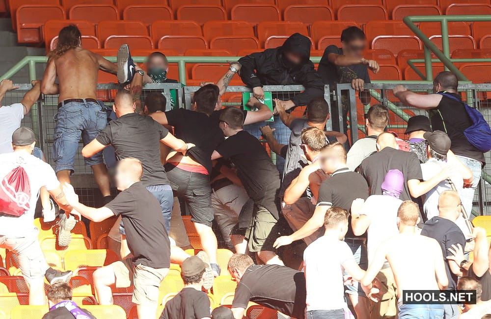 Austria Vienna and Rapid Vienna fans fight after the final whistle of their Bundesliga match at the Ernst Happel Stadium.