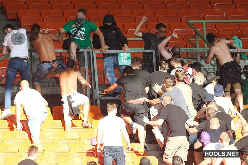 Austria Vienna and Rapid Vienna fans fight after the final whistle of their Bundesliga match at the Ernst Happel Stadium.