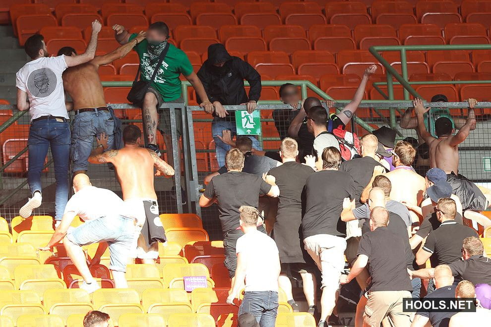 Austria Vienna and Rapid Vienna fans fight after the final whistle of their Bundesliga match at the Ernst Happel Stadium.