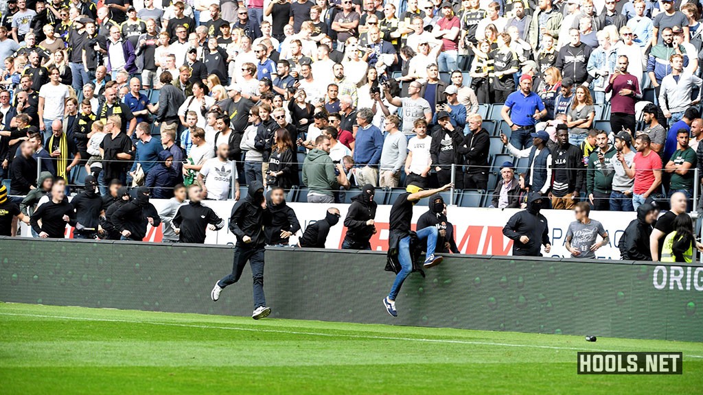 AIK hooligans run towards Djurgarden fans.