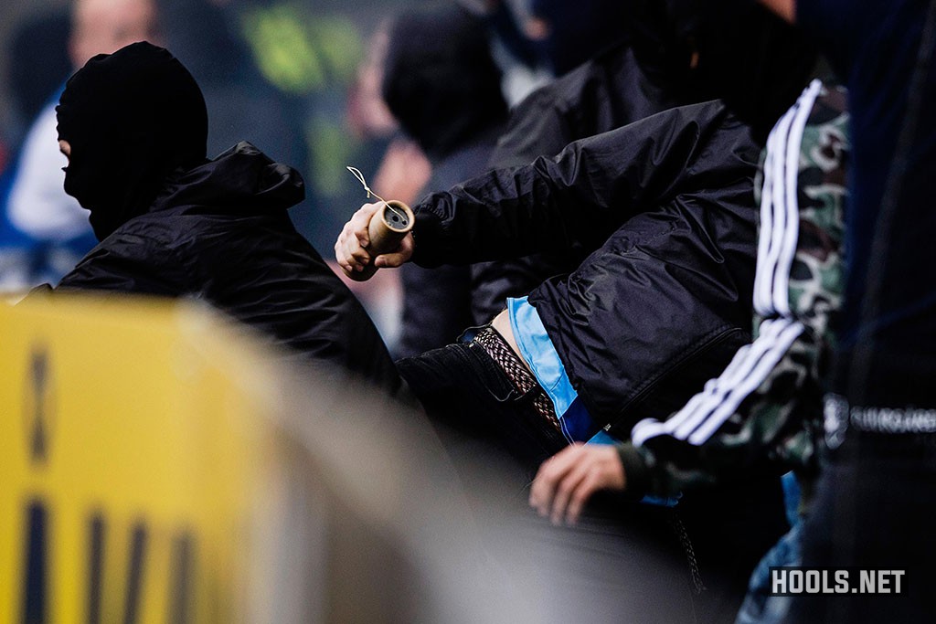 Djurgarden hooligans try to get onto the pitch