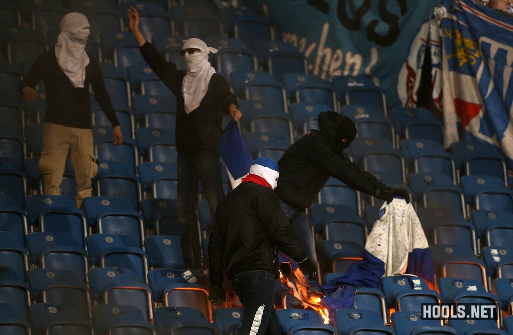 Hansa Rostock hooligans set fire to a Hertha Berlin banner during their German Cup clash