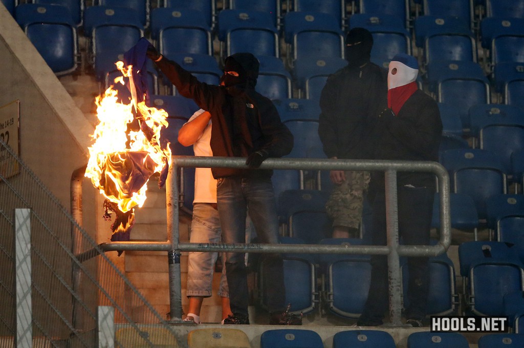 Hansa Rostock hooligans set fire to a Hertha Berlin banner during their German Cup clash