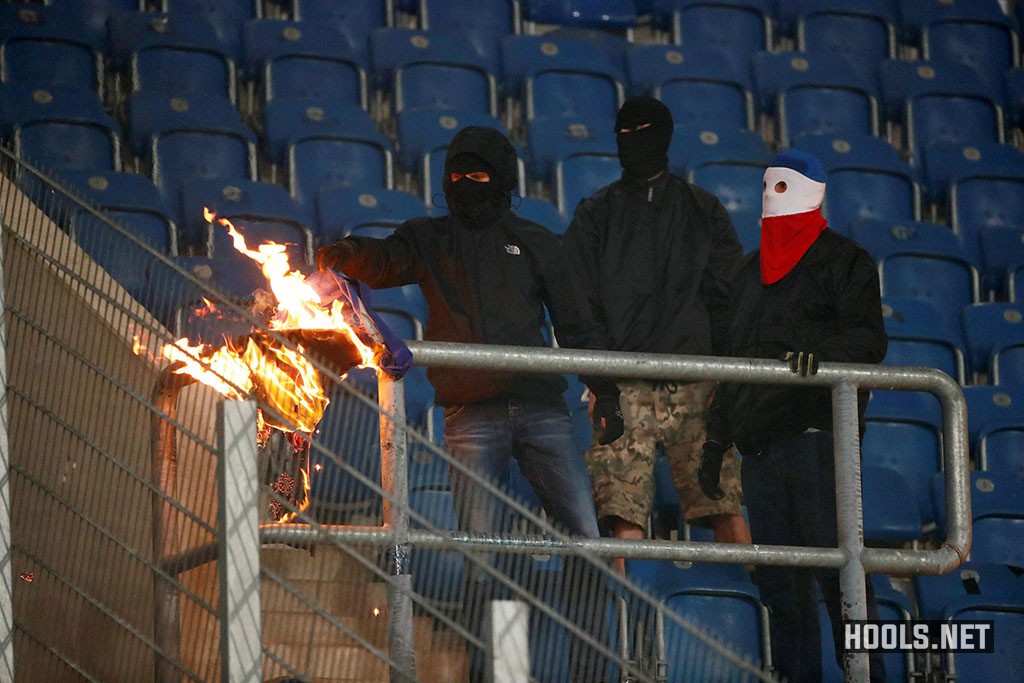 Hansa Rostock hooligans set fire to a Hertha Berlin banner during their German Cup clash