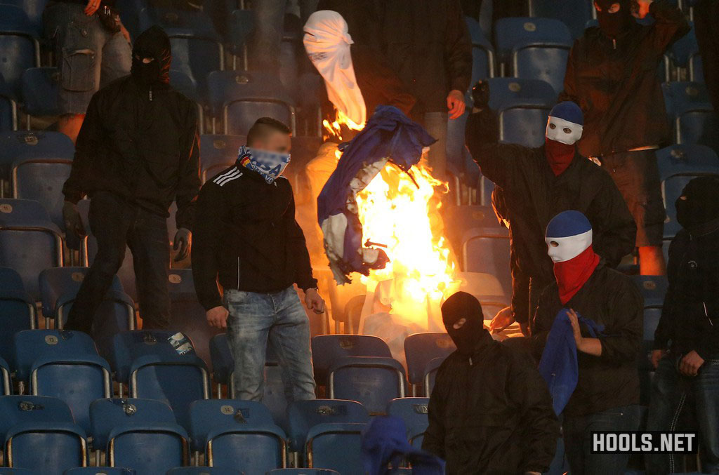 Hansa Rostock hooligans set fire to a Hertha Berlin banner during their German Cup clash