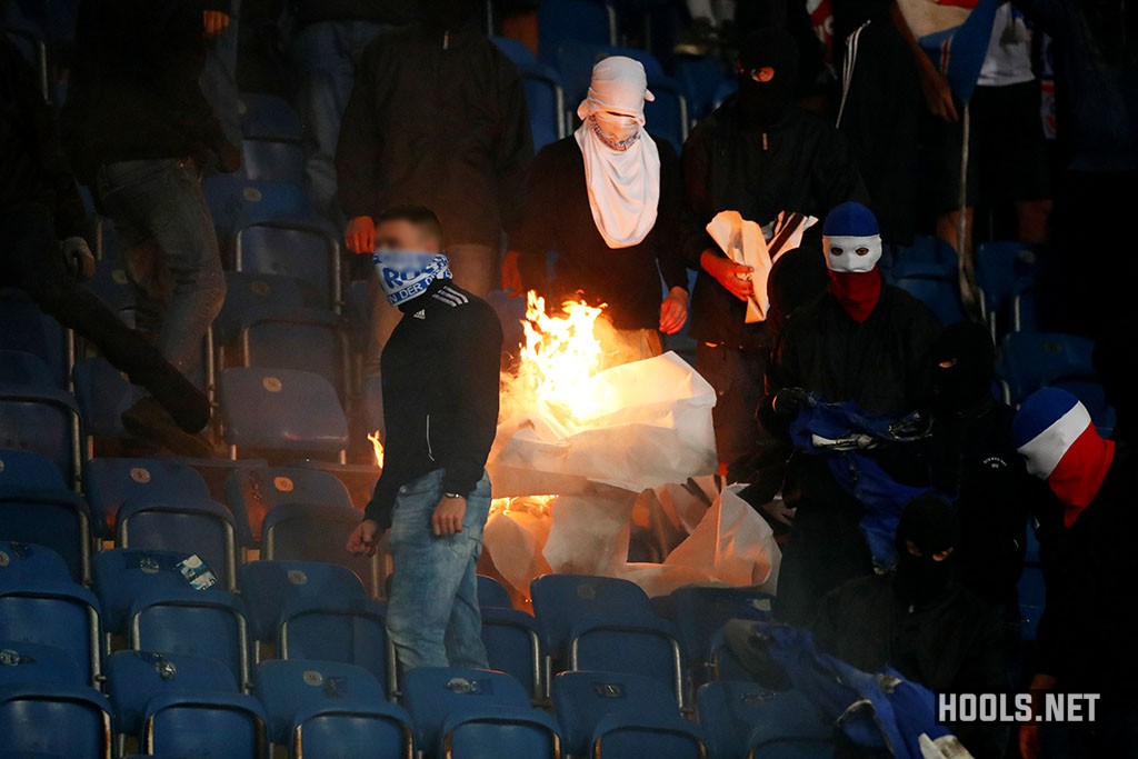 Hansa Rostock hooligans set fire to a Hertha Berlin banner during their German Cup clash