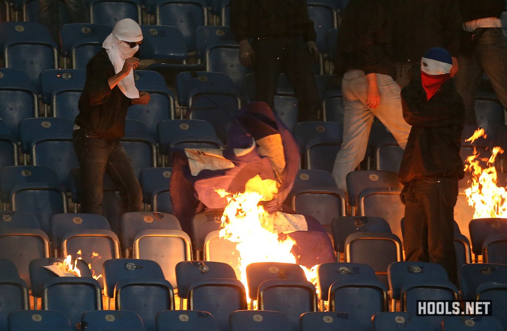 Hansa Rostock hooligans set fire to a Hertha Berlin banner during their German Cup clash