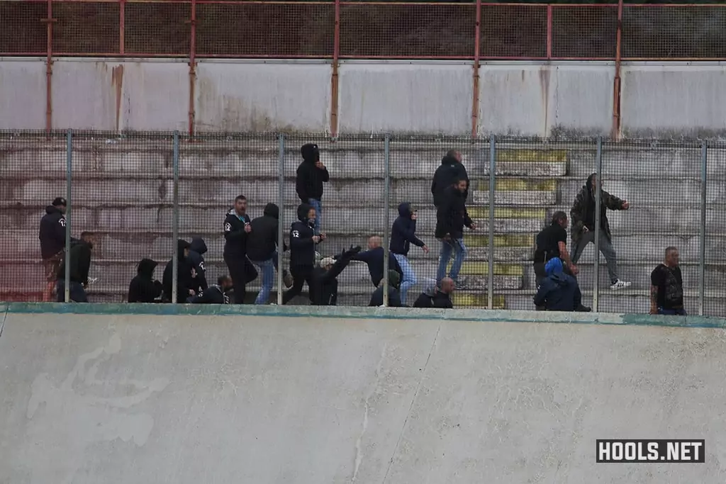 Fans of Varese and Como clash in the stands.