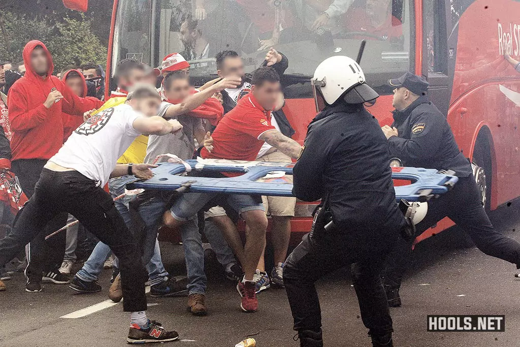 Sporting Gijon fans clash with police before their game against Real Oviedo