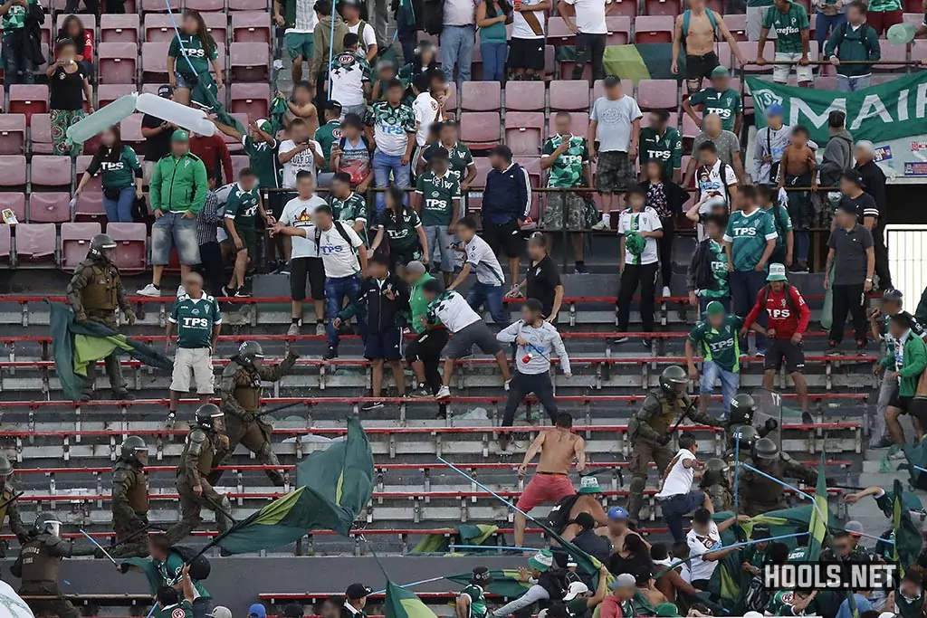 Santiago Wanderers fans clash with cops in the stands during the Chilean Super Cup final.