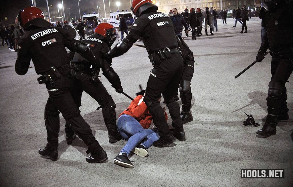 Spanish riot police hit a Spartak Moscow fan