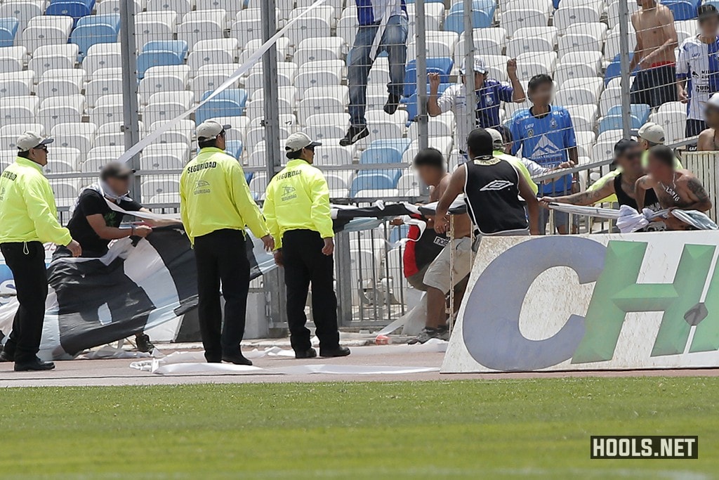 Colo-Colo fans try to snatch an Antofagasta banner