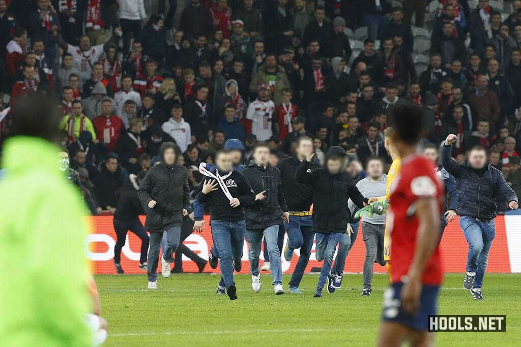 Lille fans invade the pitch following their 1-1 draw against Montpellier