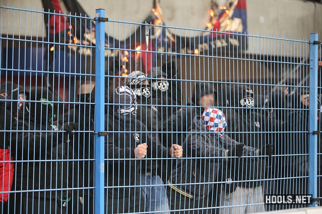 Gornik Zabrze fans try to break a fence