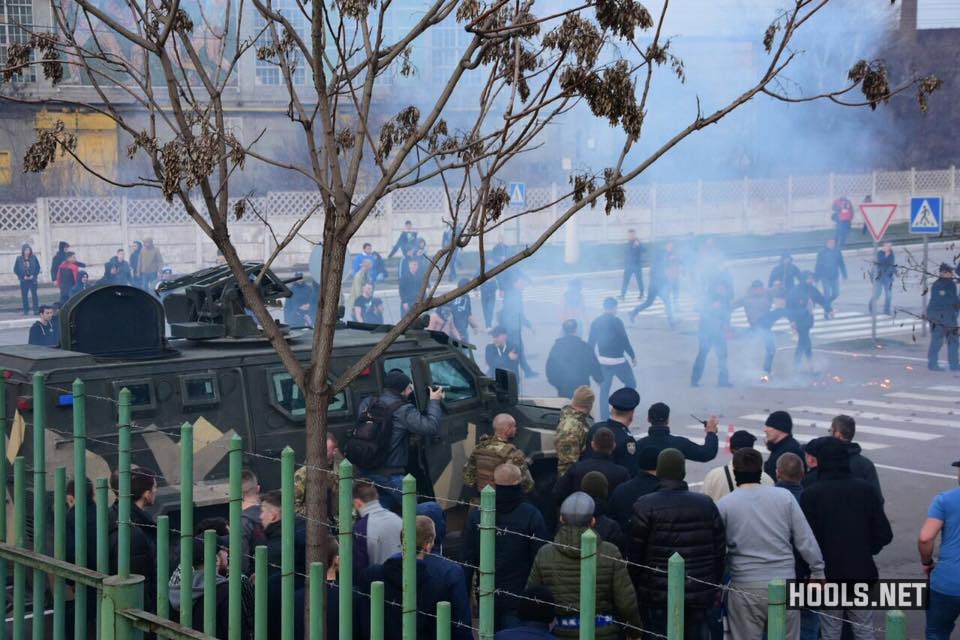 Dynamo Kyiv hooligans clash with police outside the Volodymyr Boiko Stadium.