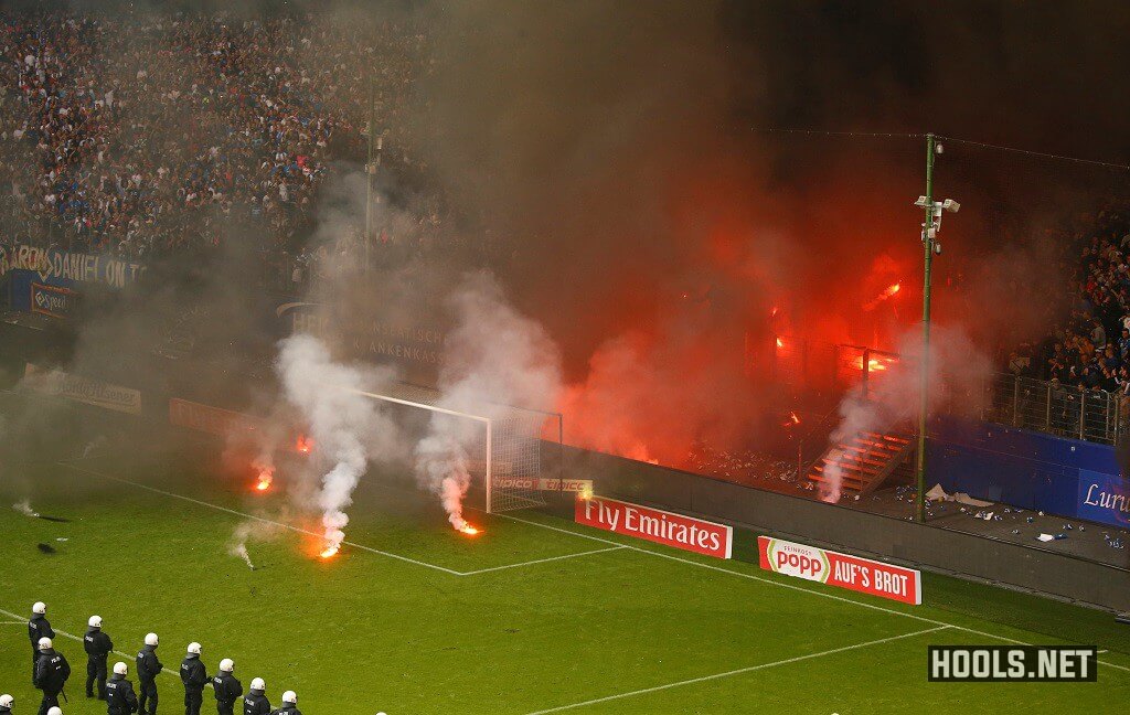 Hamburg fans throw flares onto the pitch at the end of the game