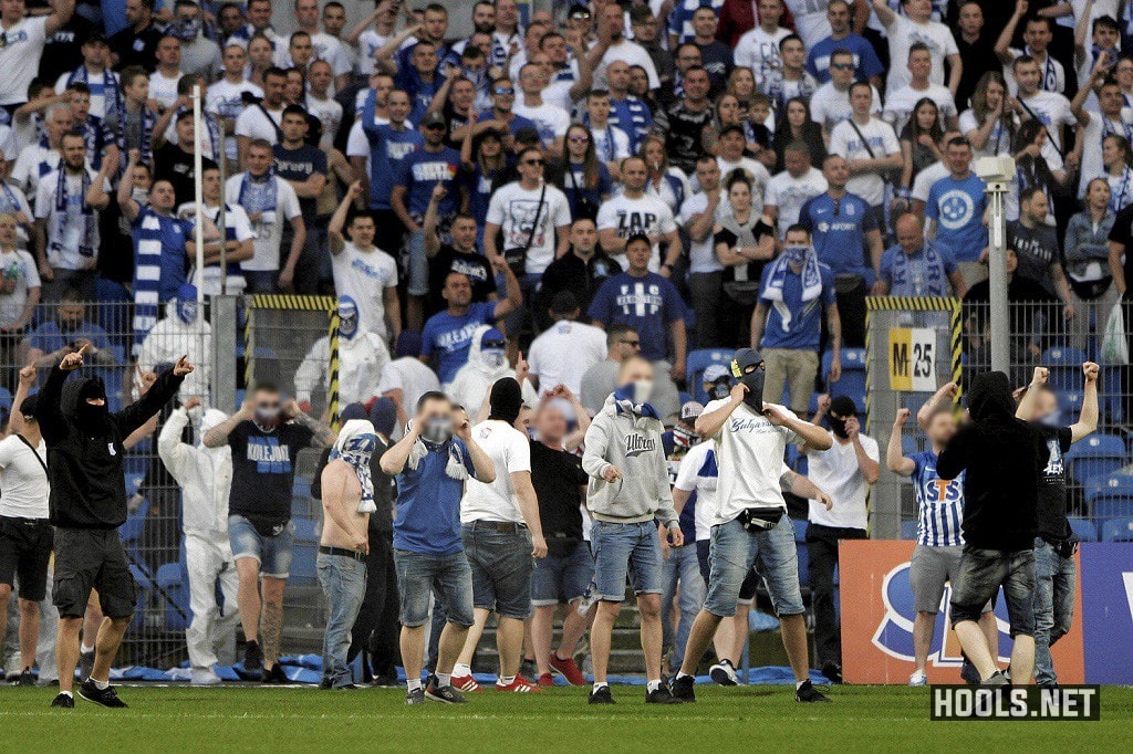 Lech Poznan hools storm the pitch during their clash with Legia.