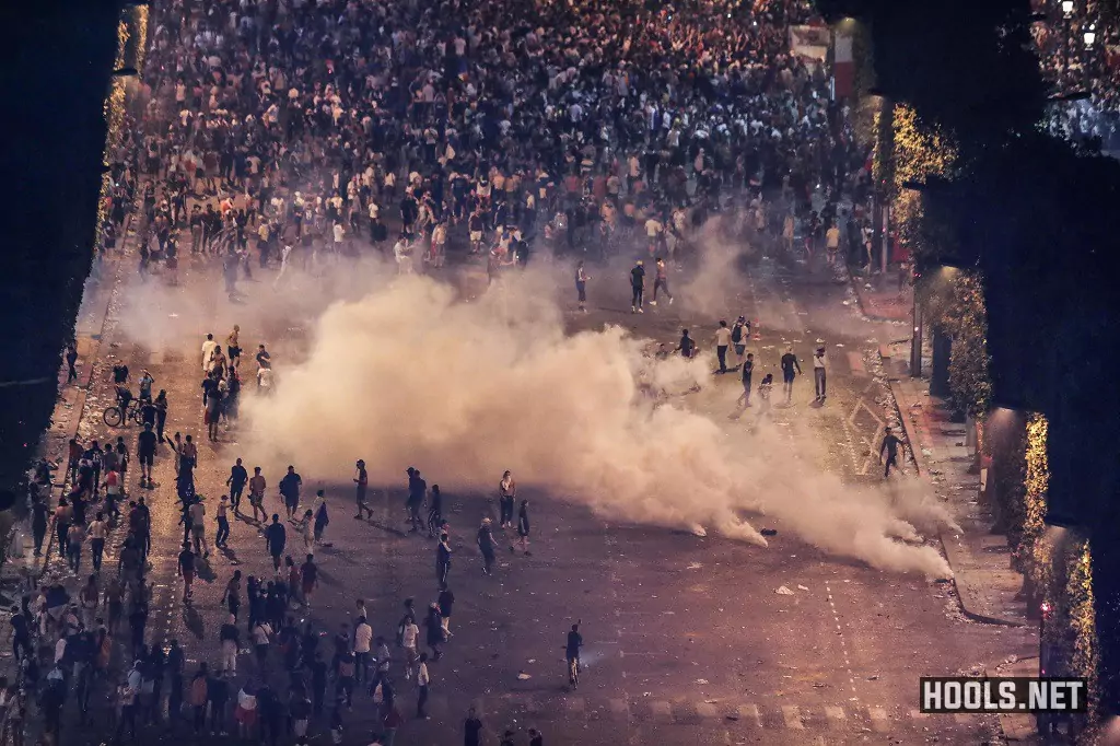 Cops throw tear gas at fans rioting in Paris following celebrations after France's World Cup victory.