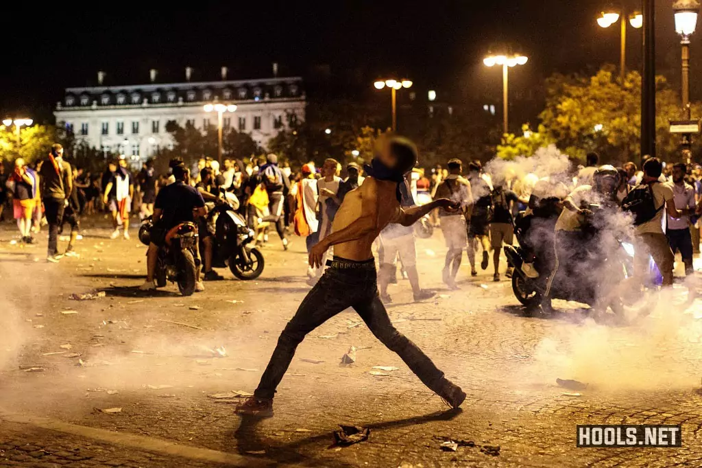 French fans clash with police following celebrations around the Arc de Triomph after France's victory against Croatia in the World Cup Final.