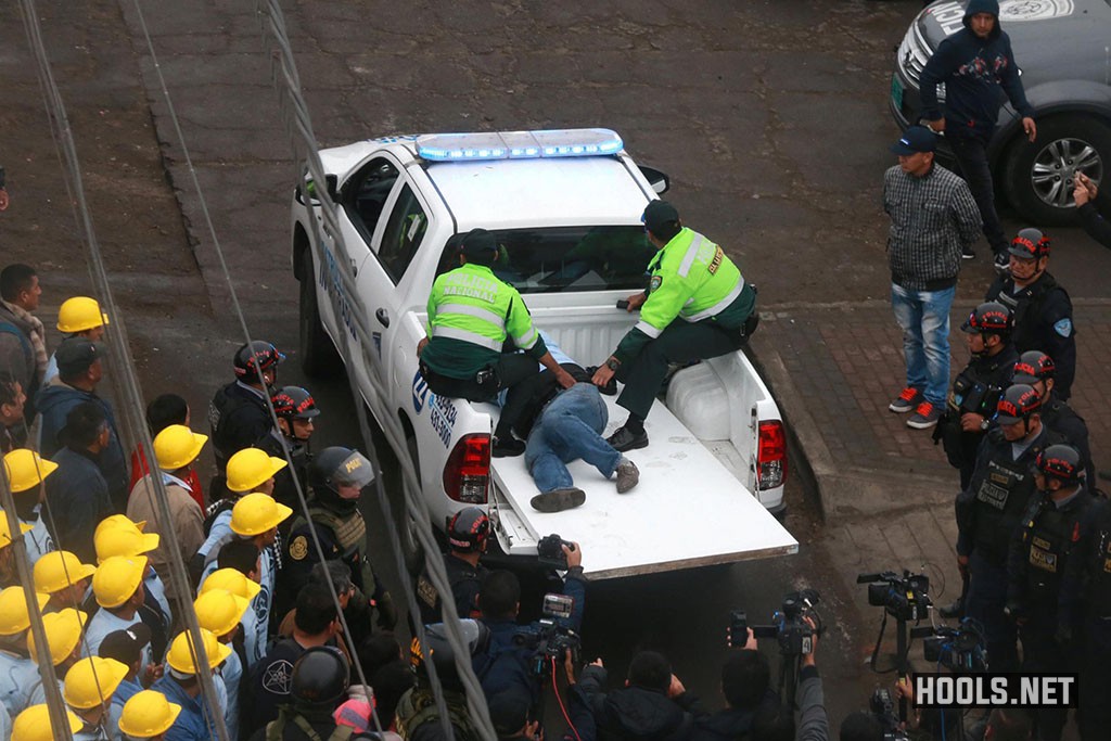 Police transport an injured man after the clash between Alianza Lima fans and evangelical Christians near the Alejandro Villanueva stadium.