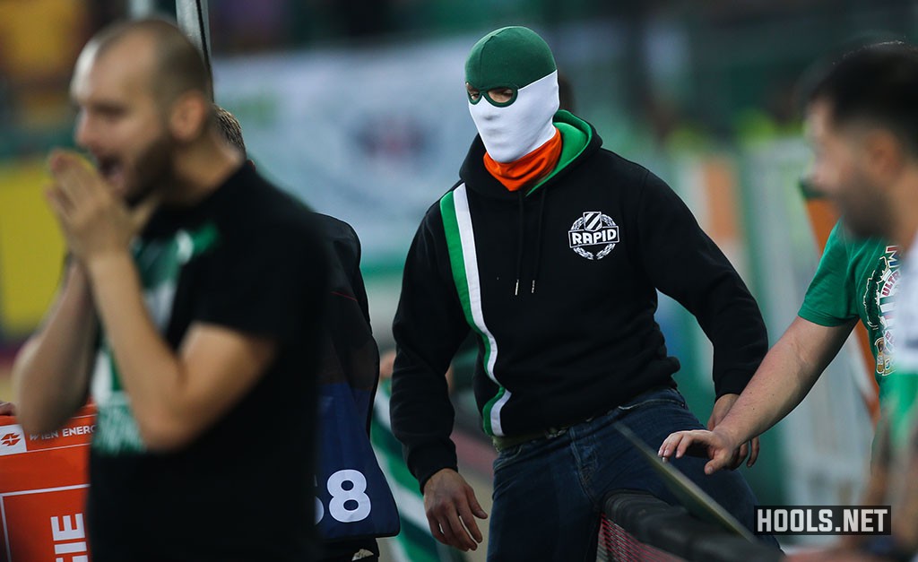 Rapid Vienna hooligans invade the pitch following the final whistle