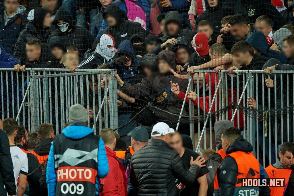 Slavia Prague fans clash with stewards in the away section of the Parken Stadium after their side's Europa League match against FC Copenhagen.