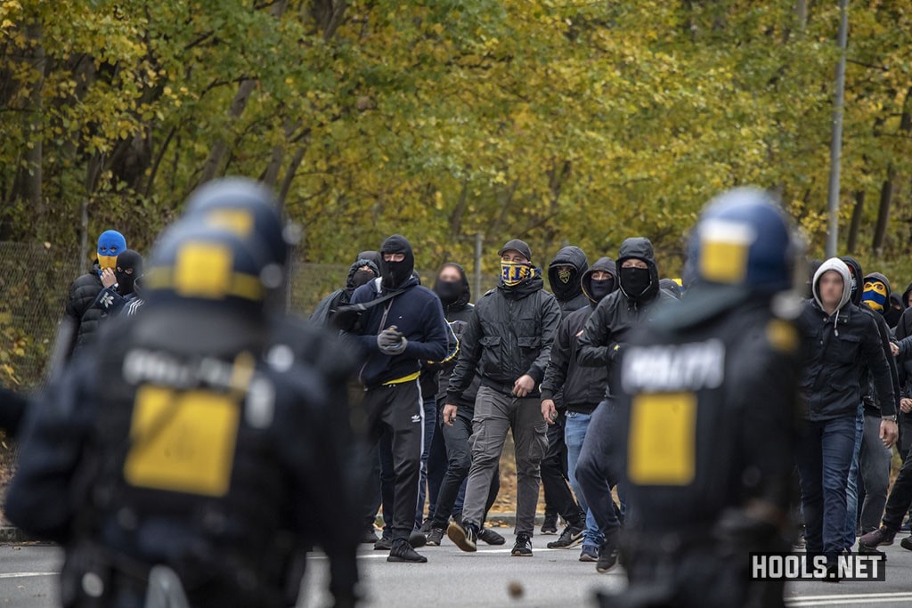 Brondby hooligans clash with riot police after their match against FC Copenhagen.