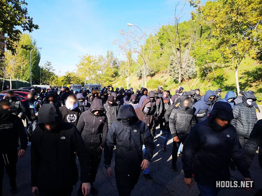 Cops escort Barcelona hooligans to Madrid’s Barajas Airport after the fight.