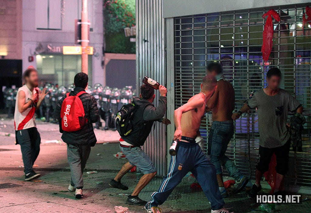 River Plate fans hurl bottles at riot police