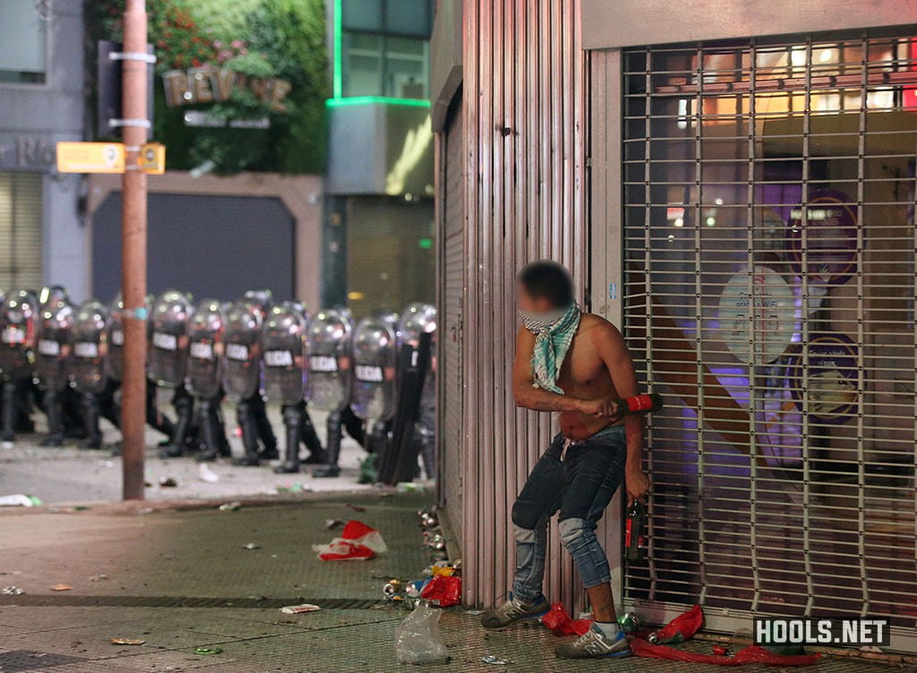 A River Plate fan during clashes with riot police in Buenos Aires