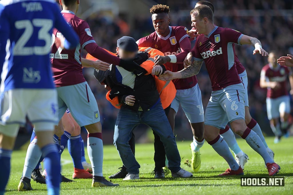 The fan was grabbed by stewards.