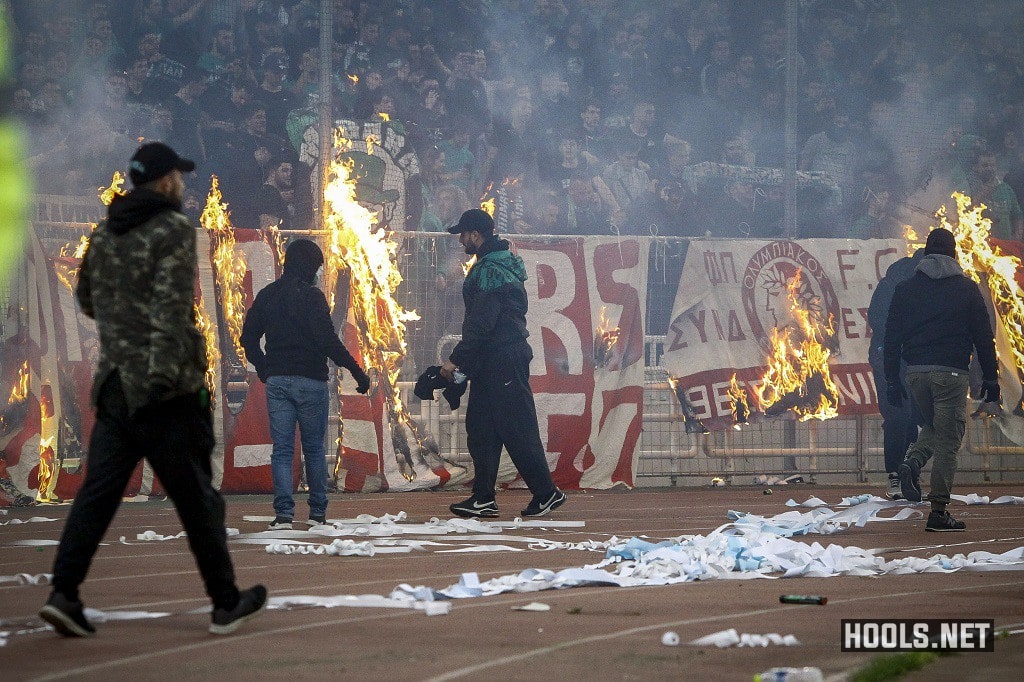 Panathinaikos hooligans set fire to banners during their derby against Olympiacos.