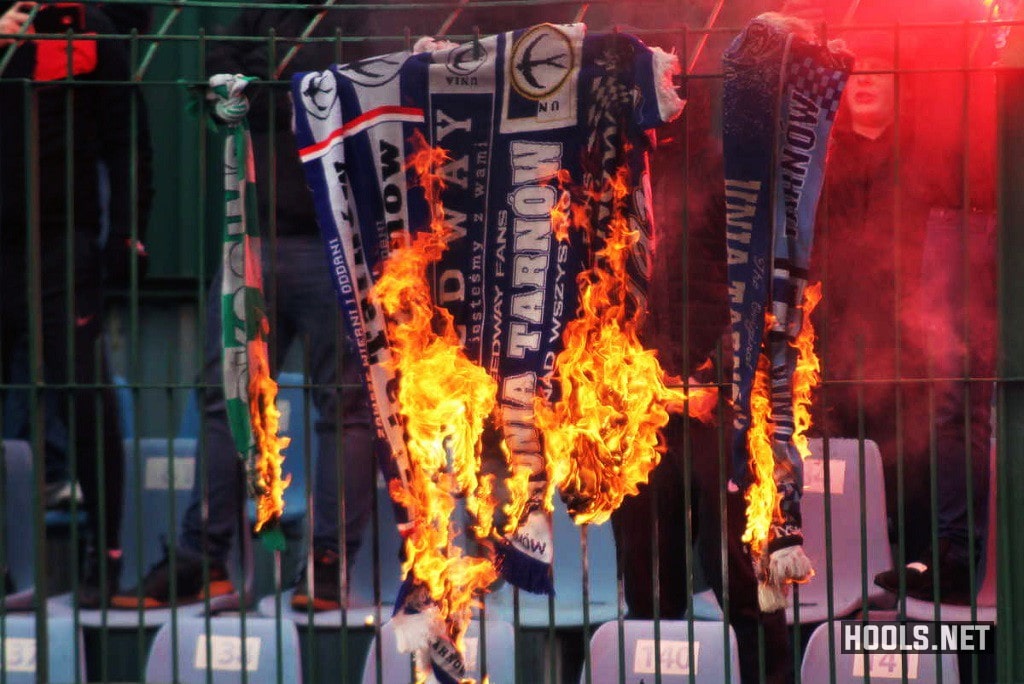 Tarnovia Tarnow fans set fire to rival fans' scarves during their clash with Okocimski Brzesko