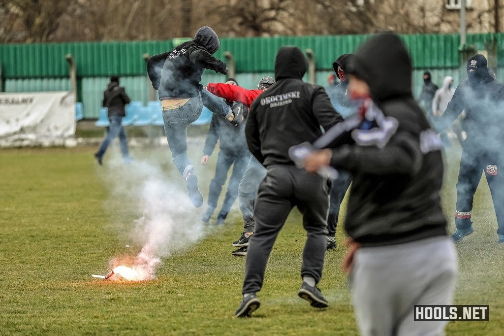 Okocimski Brzesko and Tarnovia Tarnow fans clash on the pitch during the match.