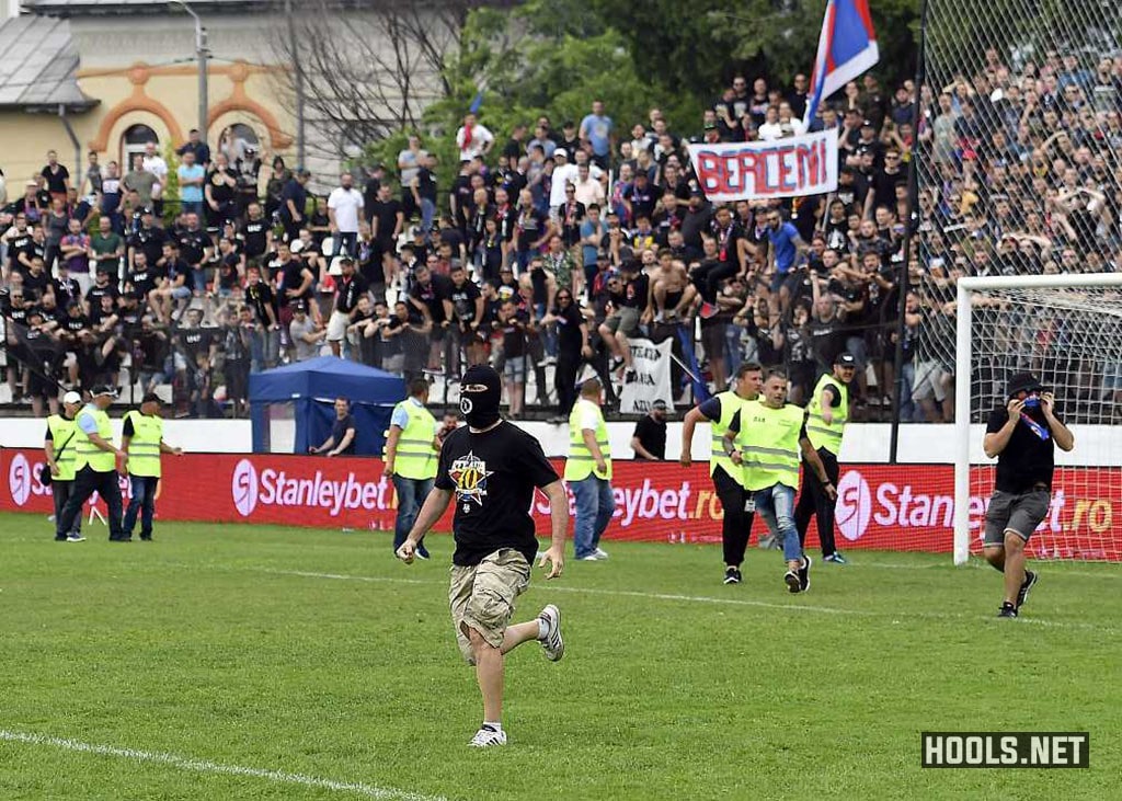 CSA Steaua Bucuresti fans invade the pitch following their side's defeat to Carmen Bucuresti.