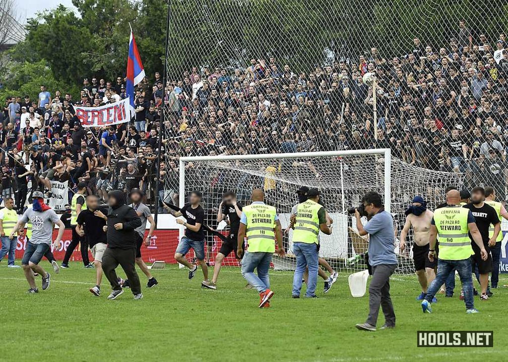 Steaua Bucuresti fans invade the pitch following their side's defeat to Carmen Bucuresti.