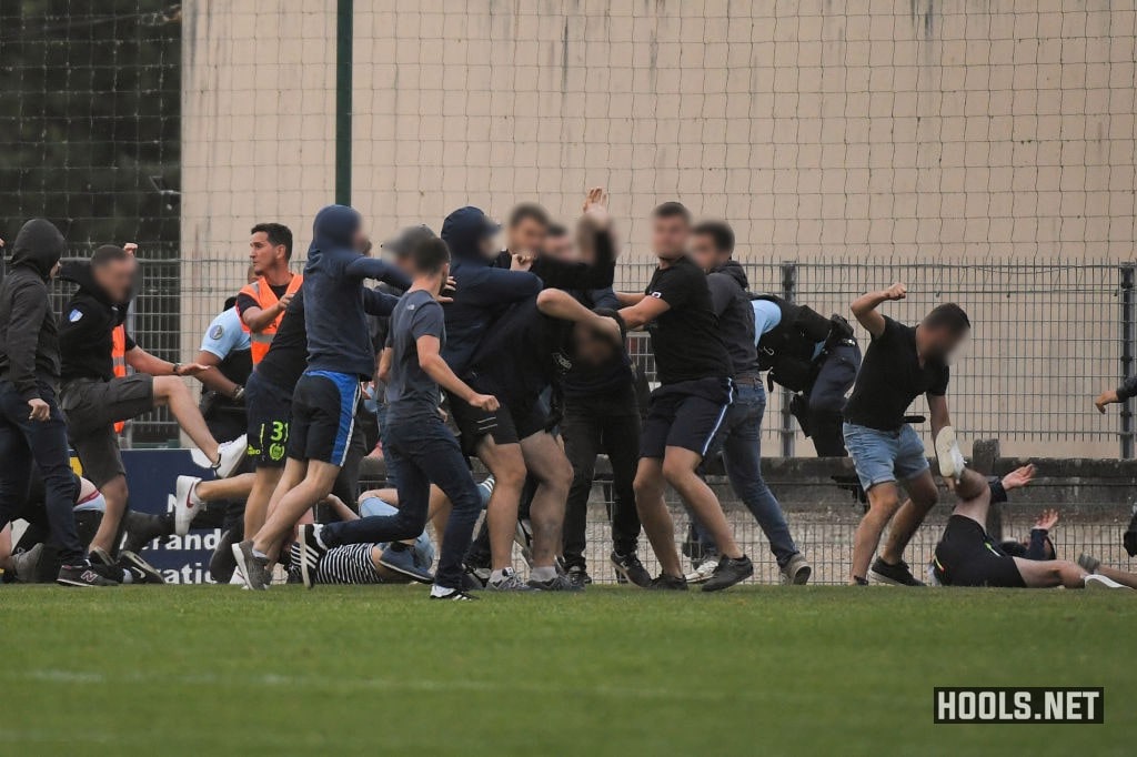 Nantes and Brest fans fight on the pitch after the full time whistle.