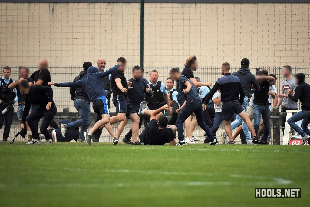 Nantes and Brest fans clash on the pitch after their pre-season friendly match.