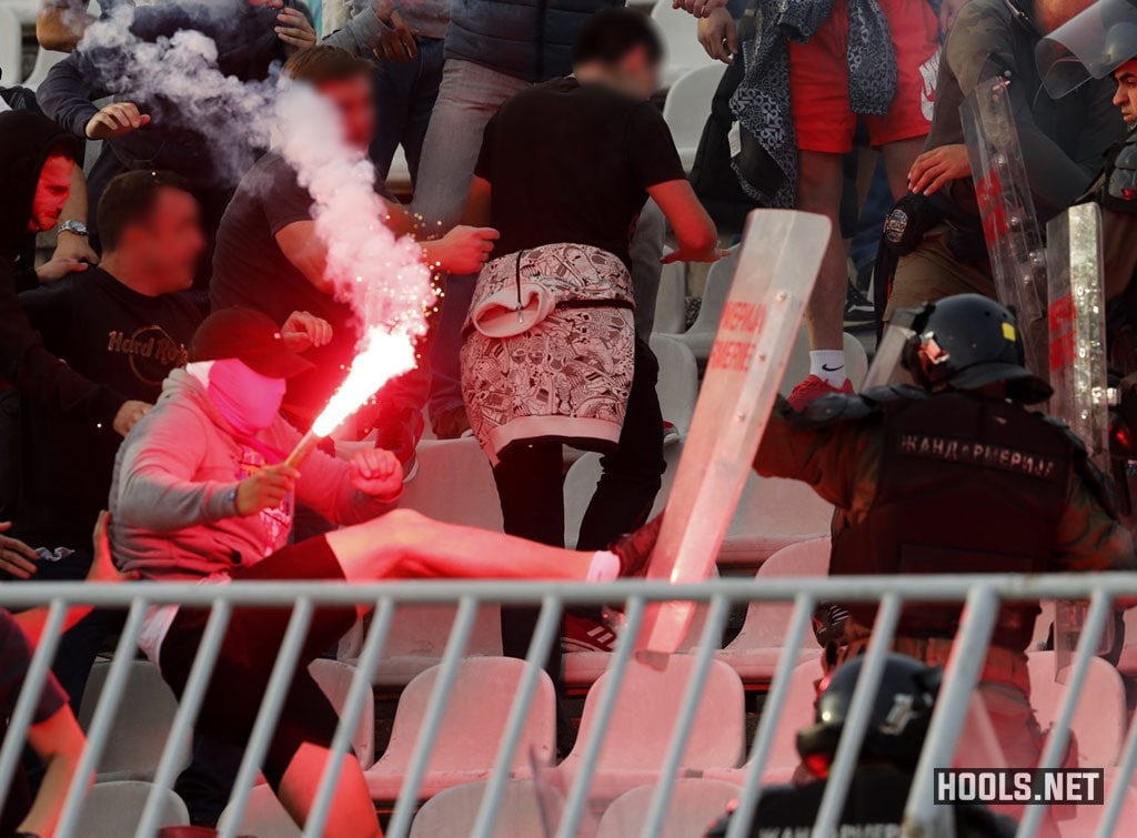 Crvena Zvezda fans clash with riot cops inside the Partizan Stadium before their match against city rivals Partizan.