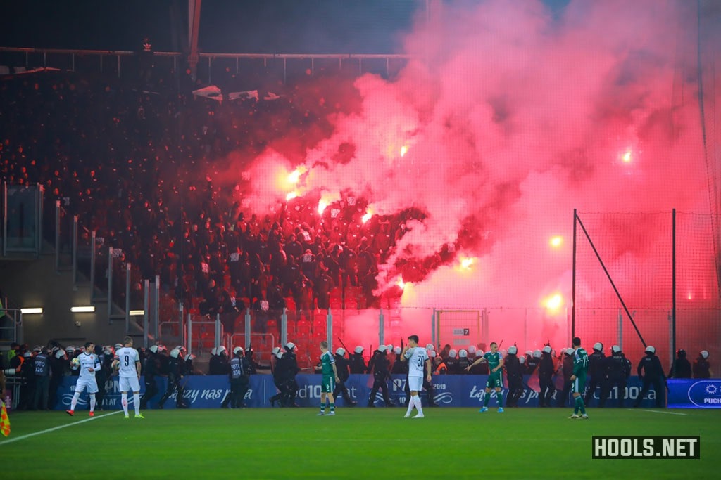 Slask Wroclaw hooligans lit flares at Widzew Lodz's stadium.