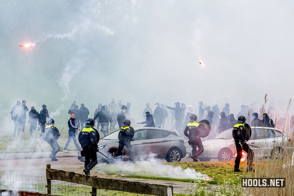 Feyenoord fans clash with police at club's training ground.