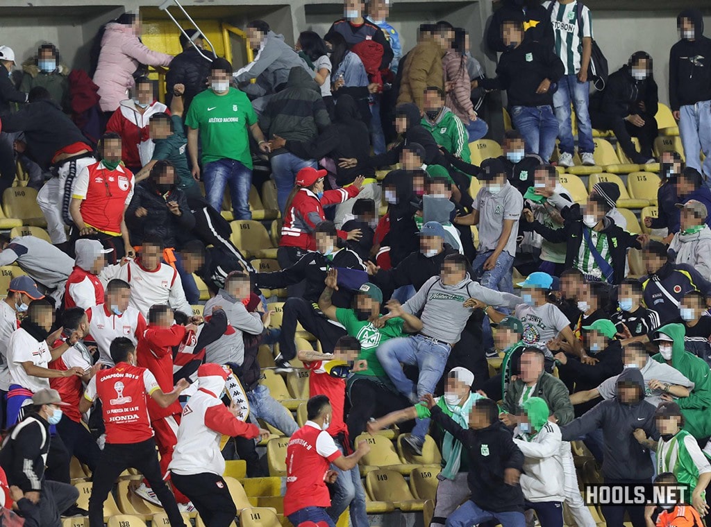 Santa Fe and Atletico Nacional supporters clash inside Bogota's El Campin stadium at half time of their Categoria Primera A match.