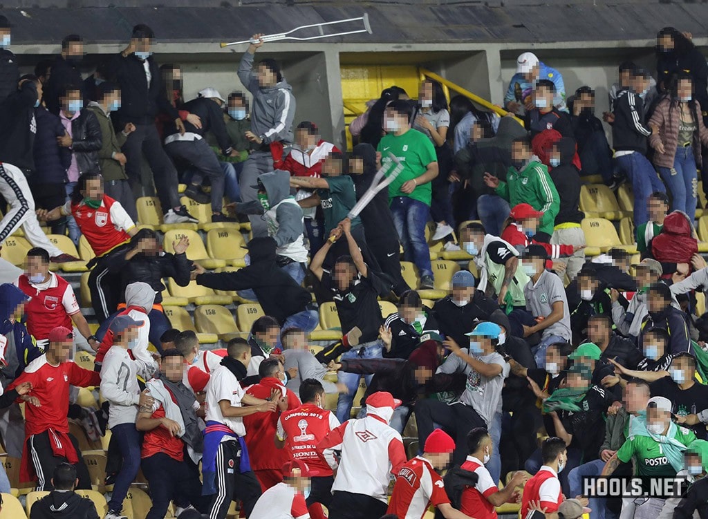 Santa Fe and Atletico Nacional supporters clash inside Bogota's El Campin stadium at half time of their Categoria Primera A match.