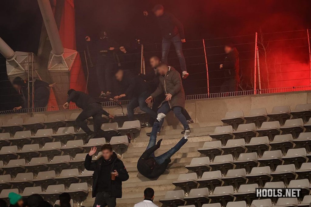 Paris FC and Lyon hooligans fight in the stands of the Charlety stadium at half-time of their French Cup tie.