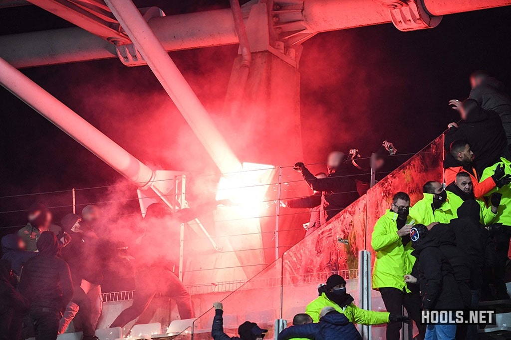 Paris FC and Lyon hooligans clash inside the Charlety stadium at half-time of their French Cup tie.