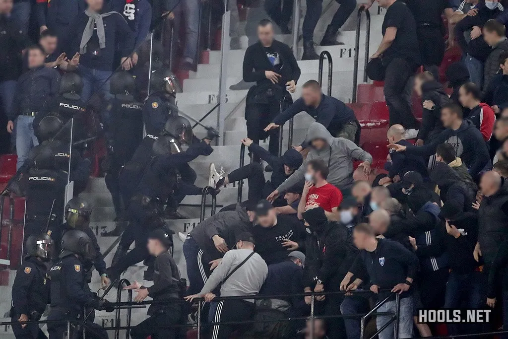 Dinamo Zagreb fans clash with police at the Ramon Sanchez-Pizjuan Stadium during their Europa League match against Sevilla.