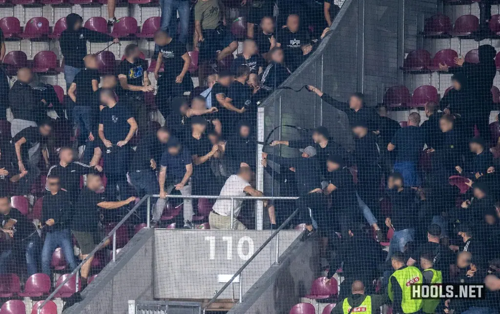 Romanian and Bosnian fans fight in the stands during their Nations League match at the Giulesti Stadium in Bucharest